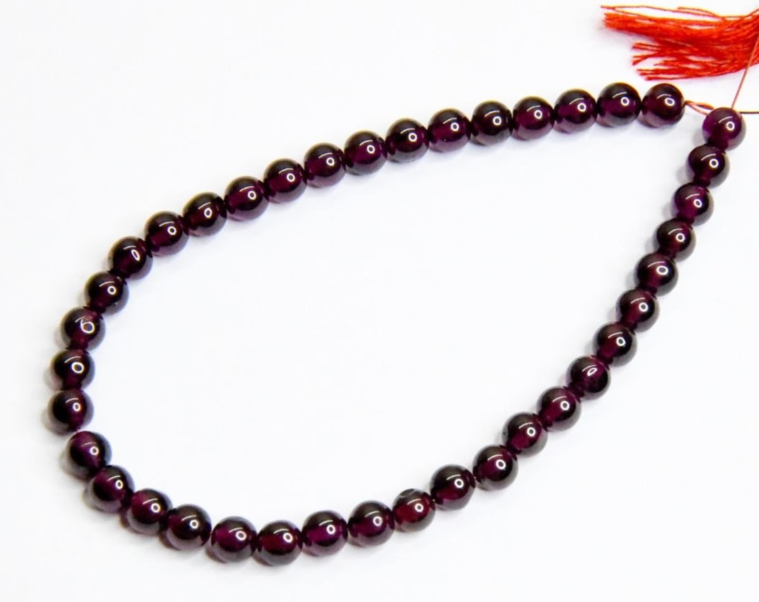 NATURAL GARNET BEADS ROUND 5 MM, 7" STRAND: These are natural, earth mined and hand crafted with precision. Stone: Garnet, Stone Shape: Round, Stone Size: 5 mm, Weight: approx. 50 carats. The photographs are generally enlarged to show the clari