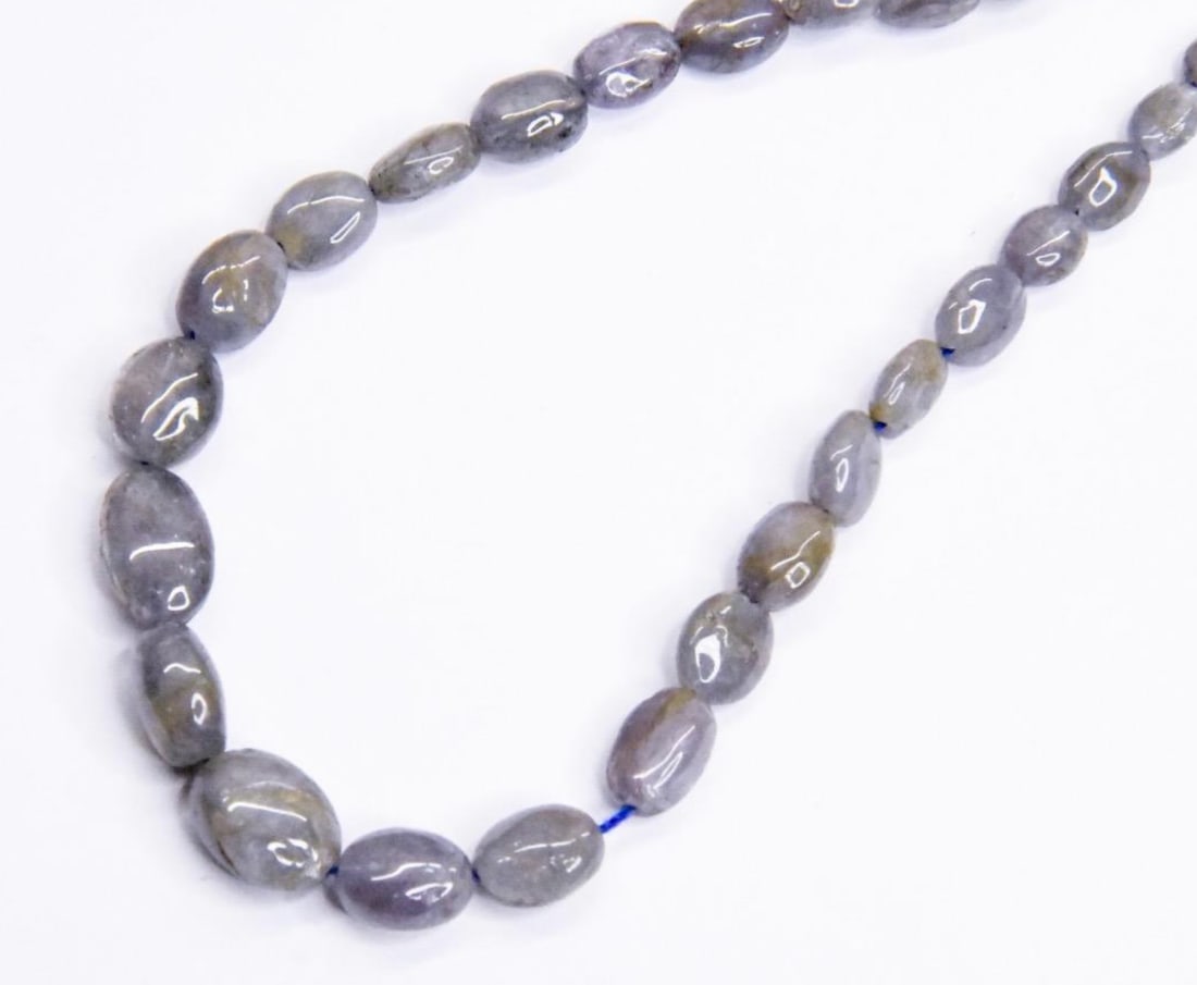 NATURAL TANZANITE BEADS OVAL 4X4 - 8X10 MM, 8.5" STRAND: These are natural, earth mined and hand crafted with precision. Stone: Tanzanite, Stone Shape: Oval, Stone Size: 4x4.5 - 8x10.5 mm, Width: 2 - 5.5 mm, Weight: approx. 40 carats. The photographs are ge