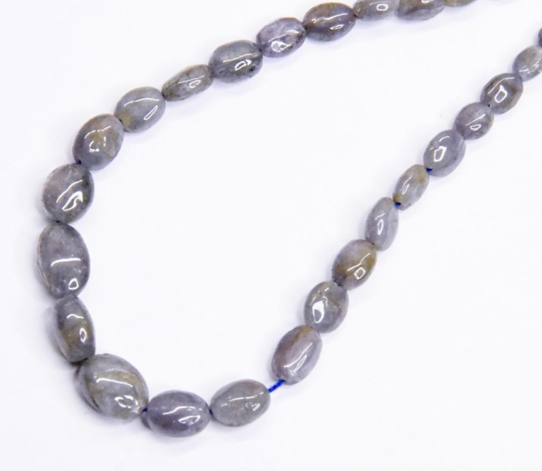 NATURAL TANZANITE BEADS OVAL 4X5 - 7X9 MM, 10" STRAND: These are natural, earth mined and hand crafted with precision. Stone: Tanzanite, Stone Shape: Oval, Stone Size: 4x5 - 7.5x9.5 mm, Width: 2 - 5 mm, Weight: approx. 49 carats. The photographs are gener