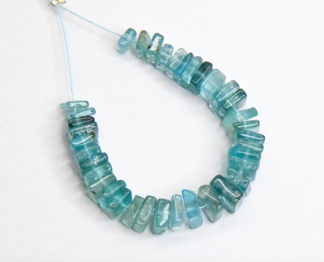 NATURAL APATITE BEADS FLAT SQUARE 4 - 6.5 MM, 36 PCS: These are natural, earth mined and hand crafted with precision. Stone: Apatite, Stone Shape: Flat Square, Stone Size: 4 - 6.5 mm, Width: 1 - 3 mm, Weight: approx. 30 carats. The photographs are genera