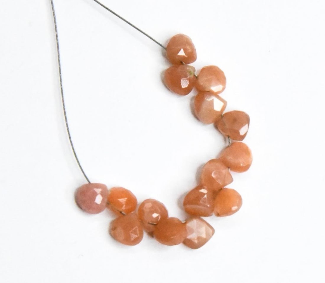 NATURAL PEACH MOONSTONE BEADS FACETED HEART 4.5 - 5 MM, 15 PCS: These are natural, earth mined and hand crafted with precision. Stone: Peach Moonstone, Stone Shape: Faceted Heart, Stone Size: 4.5 - 5 mm, Width: 2 - 3 mm, Weight: approx. 6 carats. The photographs a