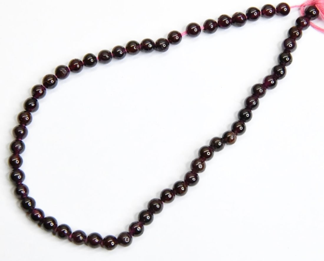 NATURAL GARNET BEADS ROUND 4 MM, 9" STRAND: These are natural, earth mined and hand crafted with precision. Stone: Garnet, Stone Shape: Round, Stone Size: 4 mm, Weight: approx. 49 carats. The photographs are generally enlarged to show the clari