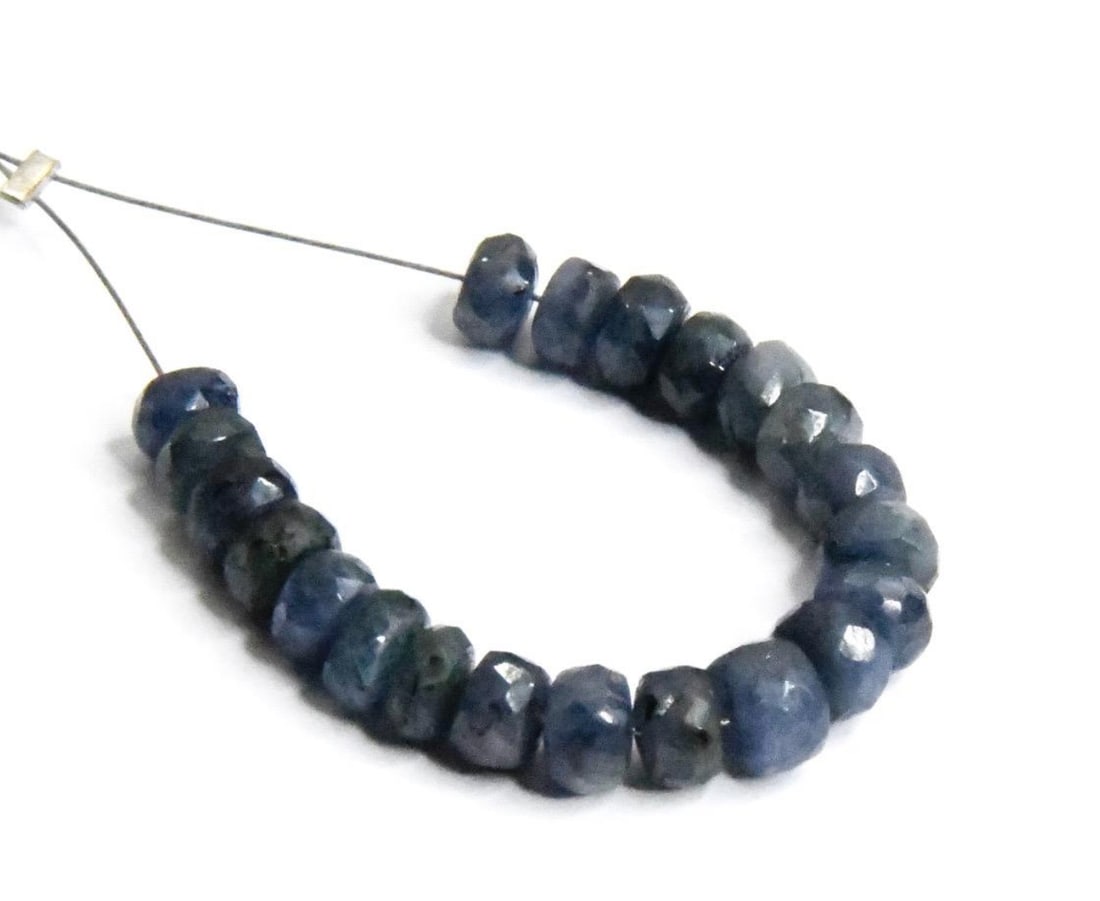 NATURAL BLUE SAPPHIRE BEADS FACETED RONDELLE 4.5 - 5.5 MM, 21 PCS (2 TASSELS): These are natural, earth mined and hand crafted with precision. Stone: Blue Sapphire, Stone Shape: Faceted Rondelle, Stone Size: 4.5 - 5.5 mm, Width: 2.5 - 3.5 mm, Weight: approx. 20 carats. The photo