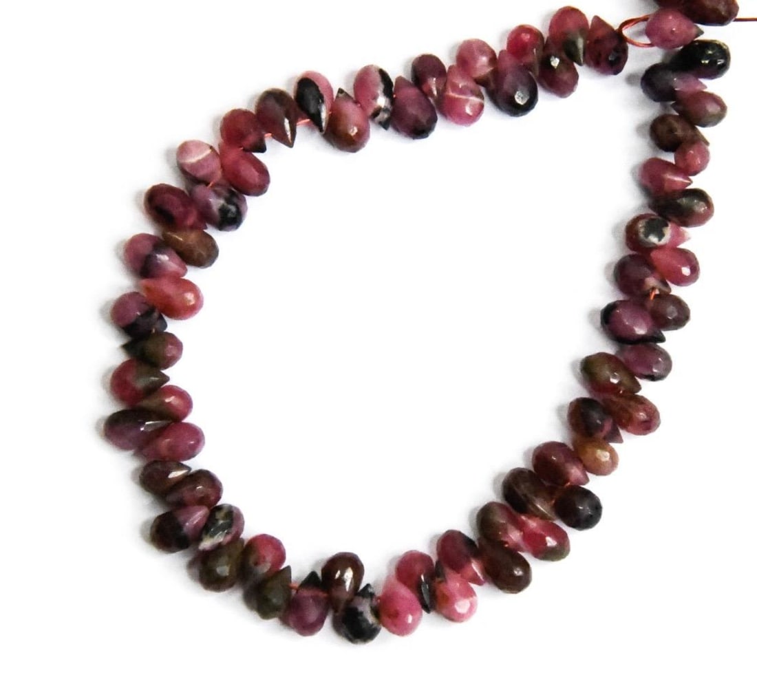NATURAL RHODONITE BEADS FACETED BRIOLETTE 2X4 - 3X5 MM, 5" STRAND (2 LINES): These are natural, earth mined and hand crafted with precision. Stone: Rhodonite, Stone Shape: Faceted Briolette, Stone Size: 2.5x4 - 3x5 mm, Weight: approx. 23 carats. The photographs are generally e
