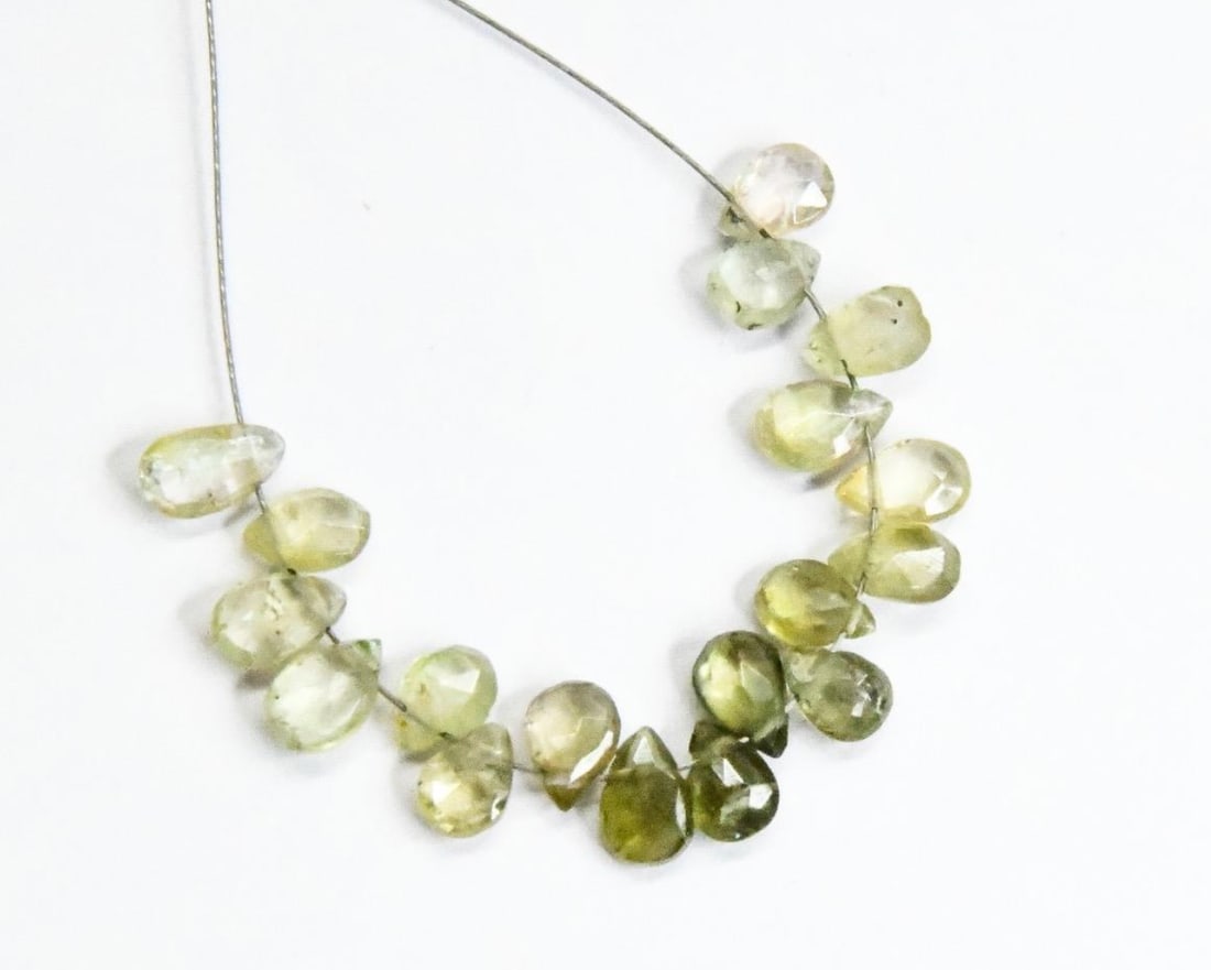 NATURAL GREEN TOURMALINE BEADS FACETED PEAR 4X5 - 4X6 MM, 18 PCS: These are natural, earth mined and hand crafted with precision. Stone: Green Tourmaline, Stone Shape: Faceted Pear, Stone Size: 4x5 - 4x6 mm, Width: 2 - 2.5 mm, Weight: approx. 7 carats. The photograp