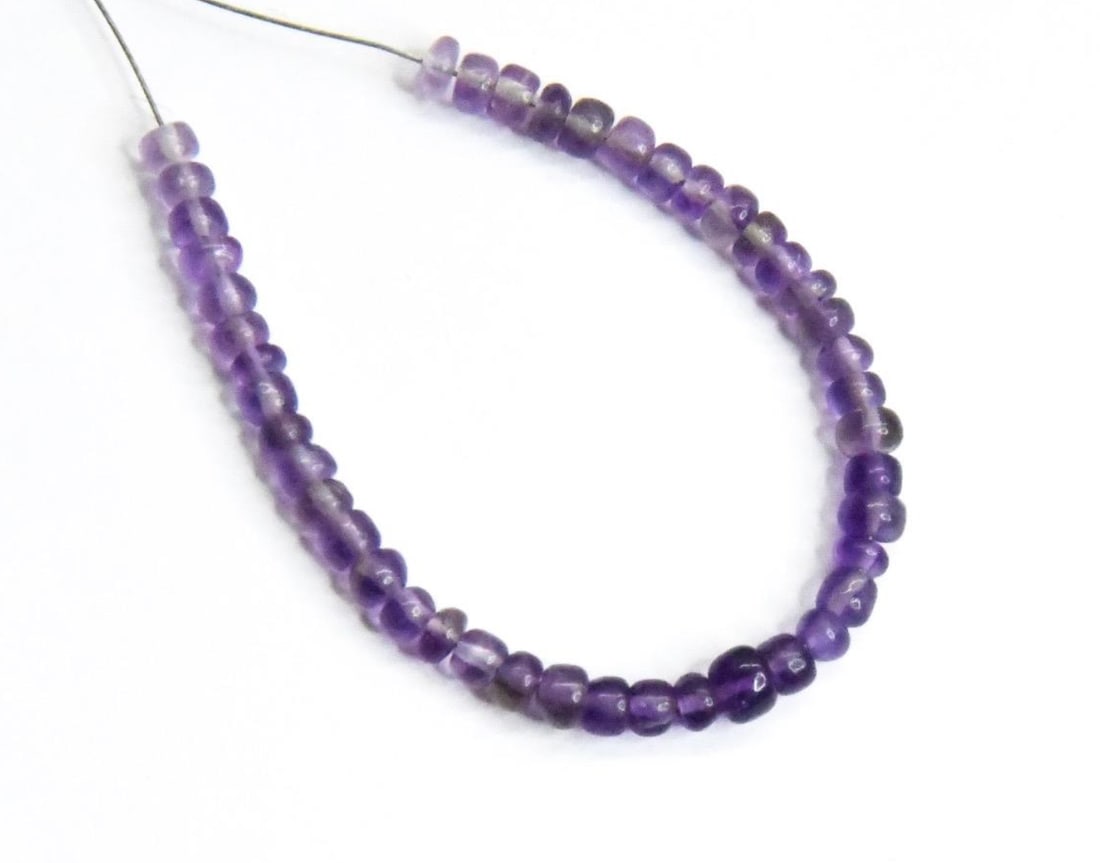 NATURAL AMETHYST BEADS RONDELLE 3 - 3.5 MM, 44 PCS: These are natural, earth mined and hand crafted with precision. Stone: Amethyst, Stone Shape: Rondelle, Stone Size: 3 - 3.5 mm, Width: 1.5 - 3 mm, Weight: approx. 7 carats. The photographs are general