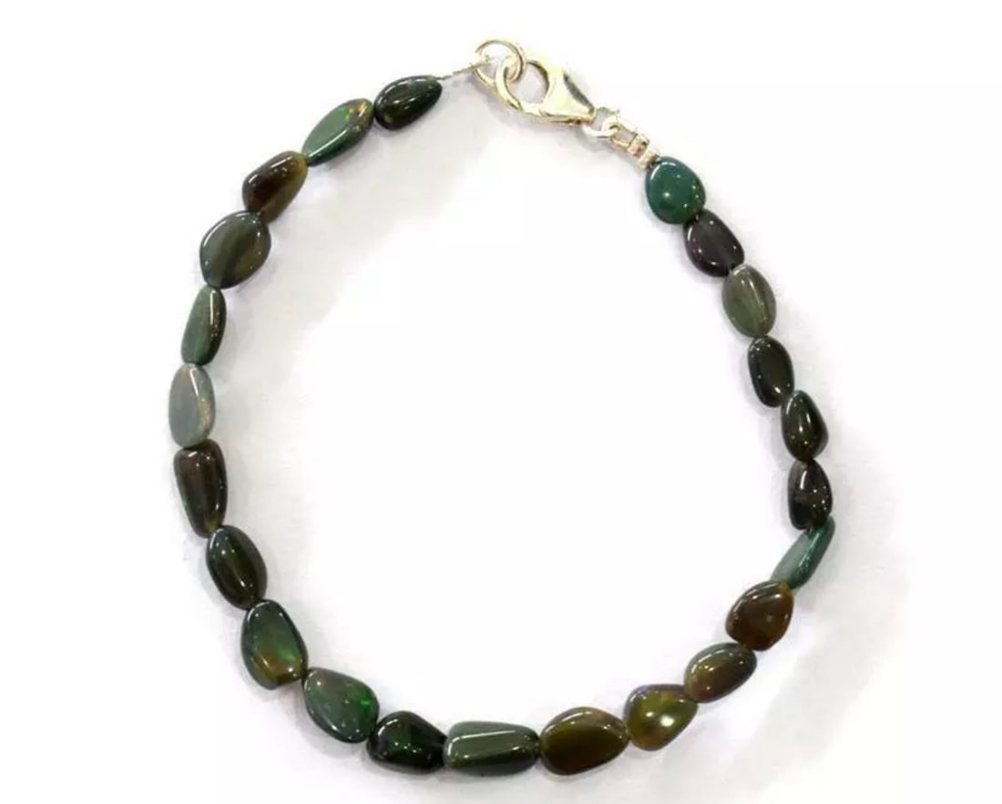 7" SOLID 925 SILVER BRACELET - NATURAL ETHIOPIAN OPAL BEADS NUGGETS: These are natural, earth mined and hand crafted with precision. Stone: Opal, Stone Shape: Nuggets, Stone Size: 4.5x7 - 6.5x8 mm, Width - 2.5 - 3 mm, Length: 7", Weight: approx. 17 carats. The photogra