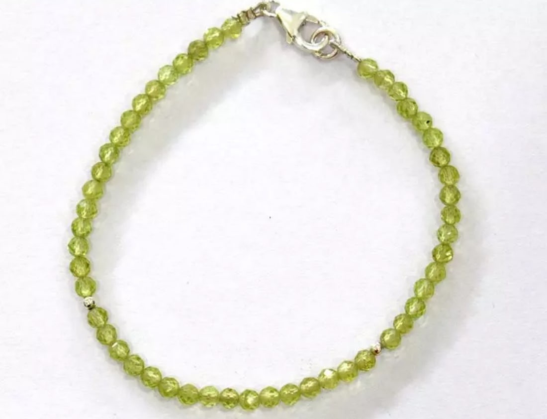 7" SOLID 925 SILVER BRACELET - NATURAL PERIDOT BEADS FACETED ROUND: These are natural, earth mined and hand crafted with precision. Stone: Peridot, Stone Shape: Faceted Round, Stone Size: 3.5 mm, Length: 7", Weight: approx. 18 carats. The photographs are generally enl