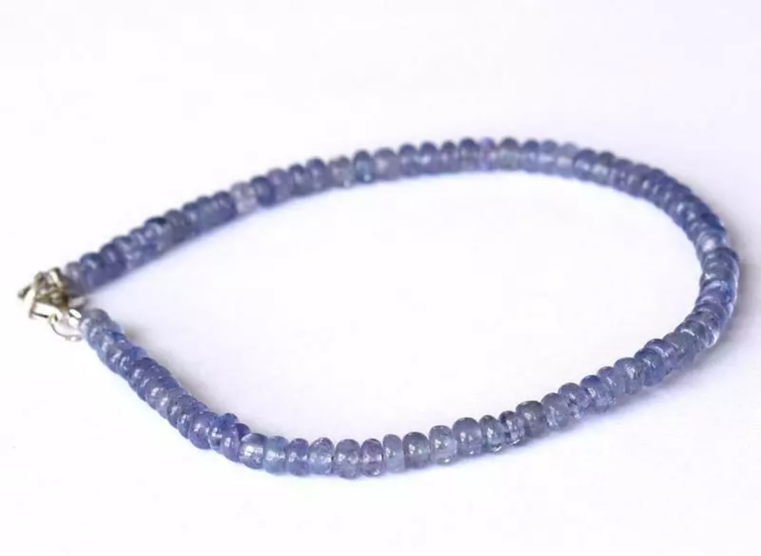 7" BRACELET NATURAL TANZANITE BEADS RONDELLE SOLID 925 SILVER: These are natural, earth mined and hand crafted with precision. Stone: Tanzanite, Stone Shape: Rondelle, Stone Size: 4mm, Width - 2 - 2.5mm, Length: 7", Weight: approx. 28 carats. The photographs are