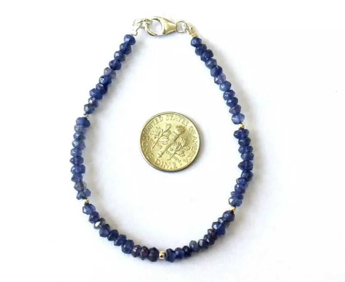 7" BRACELET NATURAL IOLITE BEADS RONDELLE SOLID 925 SILVER: These are natural, earth mined and hand crafted with precision. Stone: Iolite, Stone Shape: Faceted Rondelle, Stone Size: 3.5mm, Width - 2.5 - 3mm, Length: 7", Weight: approx. 19 carats. The photograp