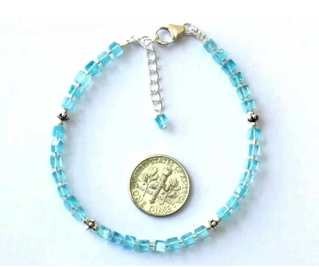 7 - 8" BRACELET NATURAL APATITE BEADS BOX SOLID 925 SILVER: These are natural, earth mined and hand crafted with precision. Stone: Apatite, Stone Shape: Box, Stone Size: 3.5mm, Length: 7 - 8", Weight: approx. 22 carats. The photographs are generally enlarged t