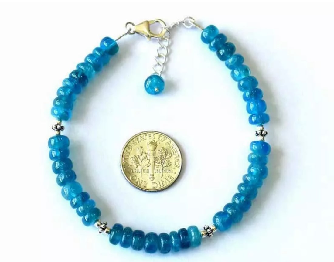 7 - 8" BRACELET NATURAL NEON APATITE BEADS SOLID 925 STERLING SILVER: These are natural, earth mined and hand crafted with precision. Stone: Apatite, Stone Shape: Rondelle, Stone Size: 6mm, Width - 2.5 - 3.5mm, Length: 7 - 8", Weight: approx. 58 carats. The photographs