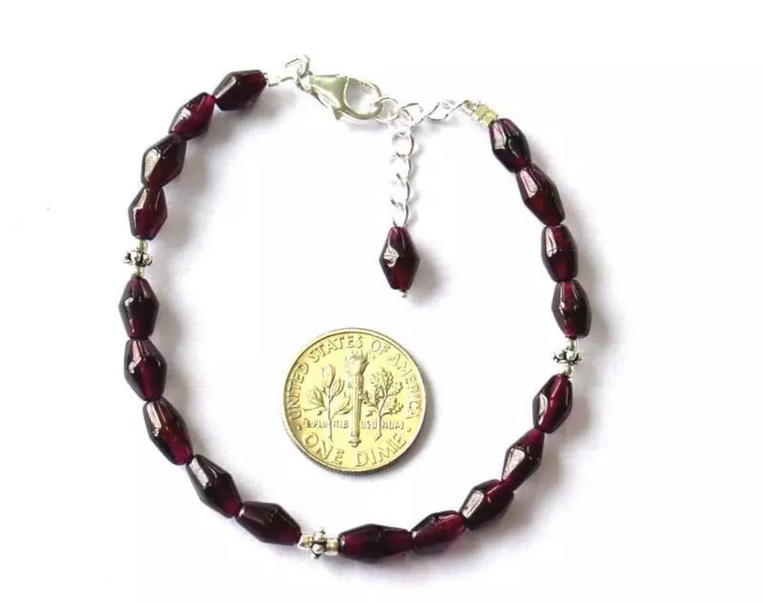6.5 - 7.5" BRACELET NATURAL GARNET BEADS FANCY SOLID 925 SILVER: These are natural, earth mined and hand crafted with precision. Stone: Garnet, Stone Shape: Fancy, Stone Size: 4x7 - 4x8mm, Length: 6.5 - 7.5", Weight: approx. 38 carats. The photographs are generally