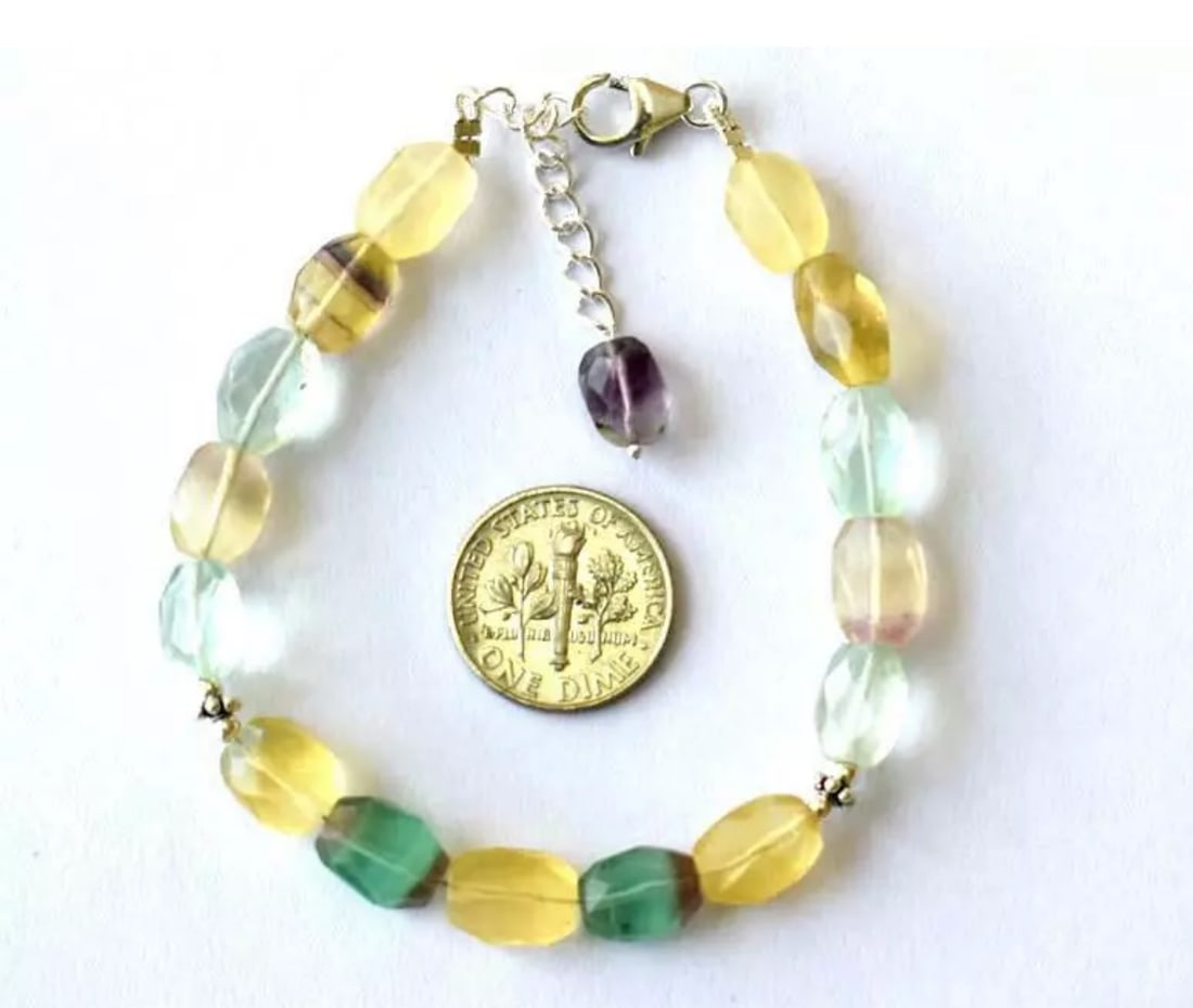 7 - 8" BRACELET NATURAL FINE MULTI FLUORITE BEADS SOLID 925 SILVER: These are natural, earth mined and hand crafted with precision. Stone: Fluorite, Stone Shape: Faceted Oval, Stone Size: 7x9 - 7x10mm, Width - 4 - 5mm, Length: 7 - 8", Weight: approx. 55 carats. The ph