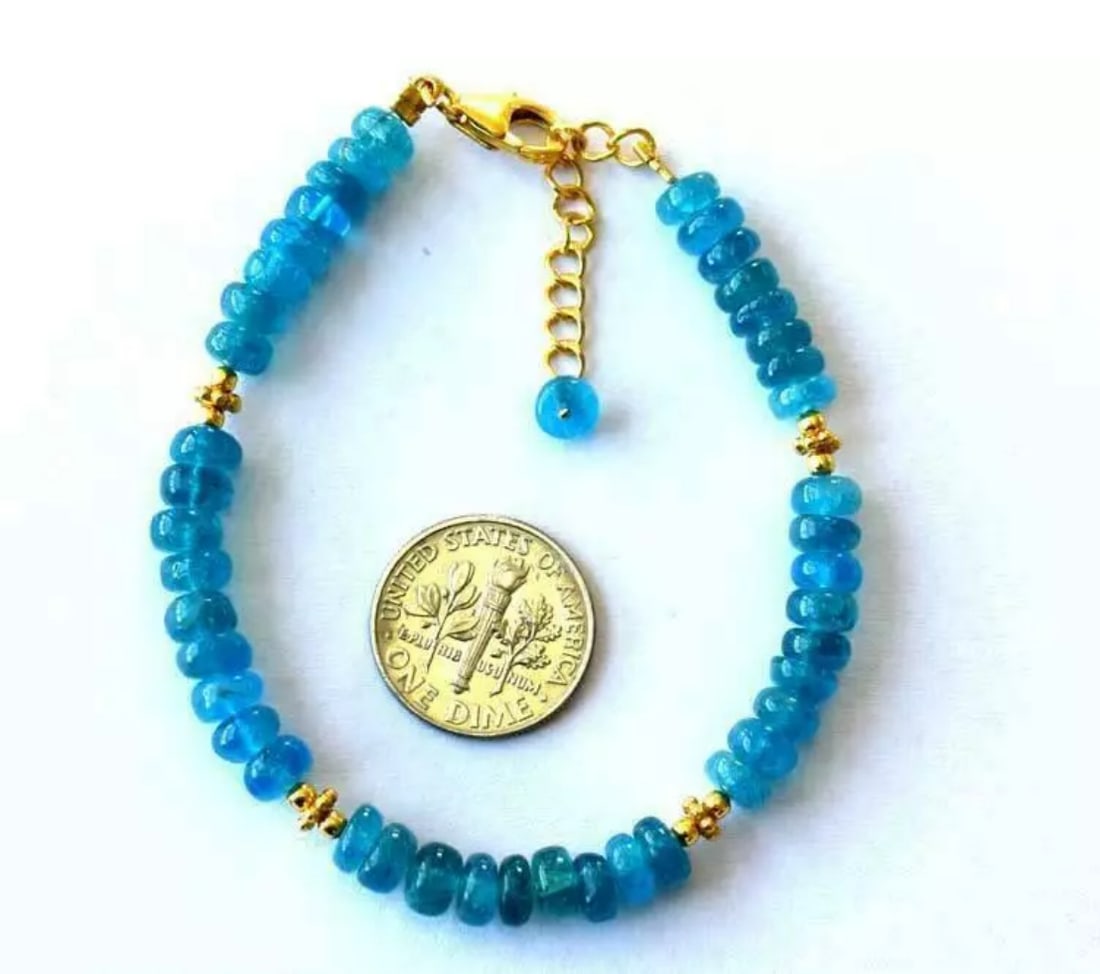 6.5 - 7.5" BRACELET NATURAL NEON APATITE BEADS VERMEIL - SOLID 925 SILVER: These are natural, earth mined and hand crafted with precision. Stone: Apatite, Stone Shape: Rondelle, Stone Size: 5.5mm, Width - 2 - 3mm, Length: 6.5 - 7.5", Weight: approx. 49 carats. The photograph