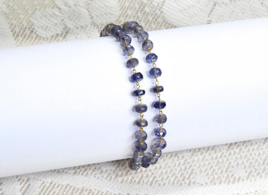 6.5 - 7.5" BRACELET IOLITE BEADS FACETED RONDELLE: Iolite is a gemstone with significant metaphysical and historical importance. It's believed to enhance intuition, mental clarity, and emotional balance. It is associated with spiritual growth, communi