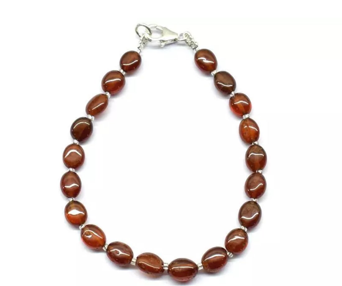 7" BRACELET NATURAL HESSONITE GARNET BEADS OVAL SOLID 925 SILVER: These are natural, earth mined and hand crafted with precision. Stone: Hessonite Garnet, Stone Shape: Oval, Stone Size: 6x6.5 - 6x8mm, Width - 3 - 4mm, Length: 7", Weight: approx. 38 carats. The photo