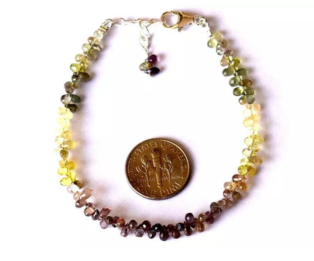 6.5 - 7.5" BRACELET NATURAL FINE GREEN SAPPHIRE BEADS SOLID 925 SILVER: These are natural, earth mined and hand crafted with precision. Stone: Sapphire, Stone Shape: Faceted Briolette, Stone Size: 2.5x3.5 - 2.5x4.5mm, Length: 6.5 - 7.5", Weight: approx. 23 carats. The pho