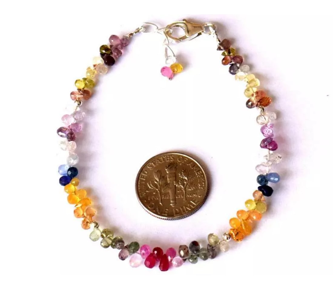 6.5 - 7.5" BRACELET NATURAL FINE MULTI SAPPHIRE BEADS SOLID 925 SILVER: These are natural, earth mined and hand crafted with precision. Stone: Sapphire, Stone Shape: Faceted Briolette, Stone Size: 2x3 - 3x4mm, Length: 6.5 - 7.5", Weight: approx. 23.60 carats. The photogra
