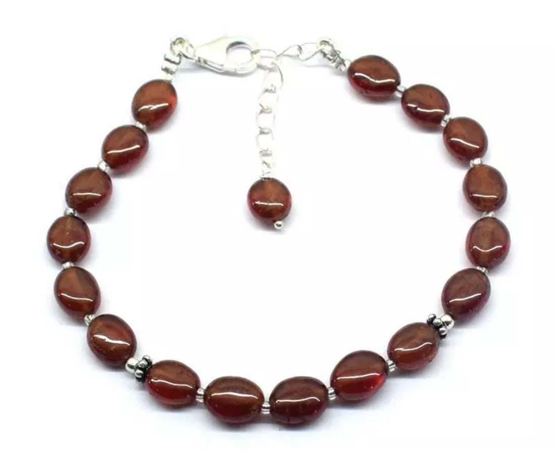 6.5 - 7.5" BRACELET NATURAL HESSONITE GARNET BEADS OVAL SOLID 925 SILVER: These are natural, earth mined and hand crafted with precision. Stone: Hessonite Garnet, Stone Shape: Oval, Stone Size: 6x7 - 6x8mm, Width - 3.5 - 4mm, Length: 6.5 - 7.5", Weight: approx. 43.50 carats