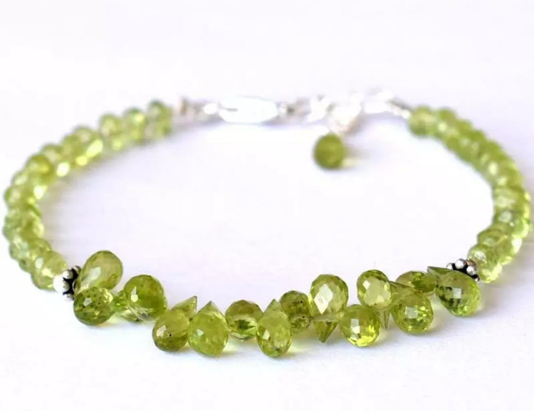 6.5 - 7.5" BRACELET NATURAL PERIDOT BEADS BRIOLETTE SOLID 925 SILVER: These are natural, earth mined and hand crafted with precision. Stone: Peridot, Shape: Rondelle/Faceted Briolette, Size: 4mm/4x6 - 4x7mm, Length: 6.5 - 7.5", Weight: approx. 28.50 carats. The photogra