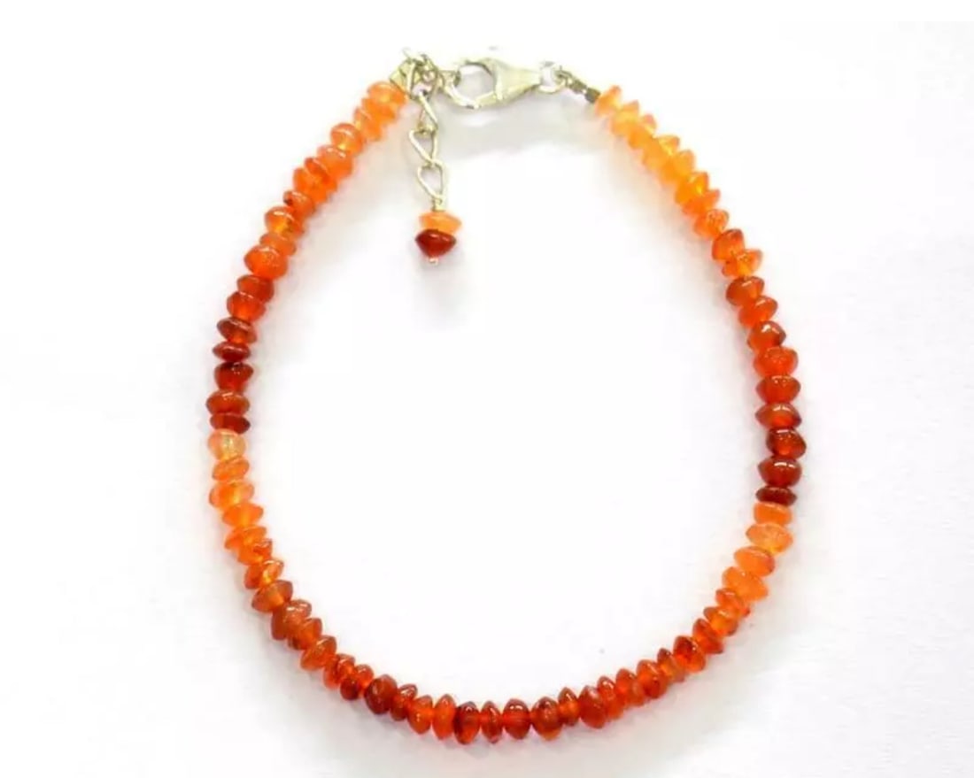 7 - 8" BRACELET NATURAL CARNELIAN BEADS RONDELLE SOLID 925 SILVER: These are natural, earth mined and hand crafted with precision. Stone: Carnelian, Shape: Rondelle, Size: 4 mm, Width: 1.5 - 2.5 mm, Length: 7 - 8", Weight: approx. 24 carats. The photographs are enlar