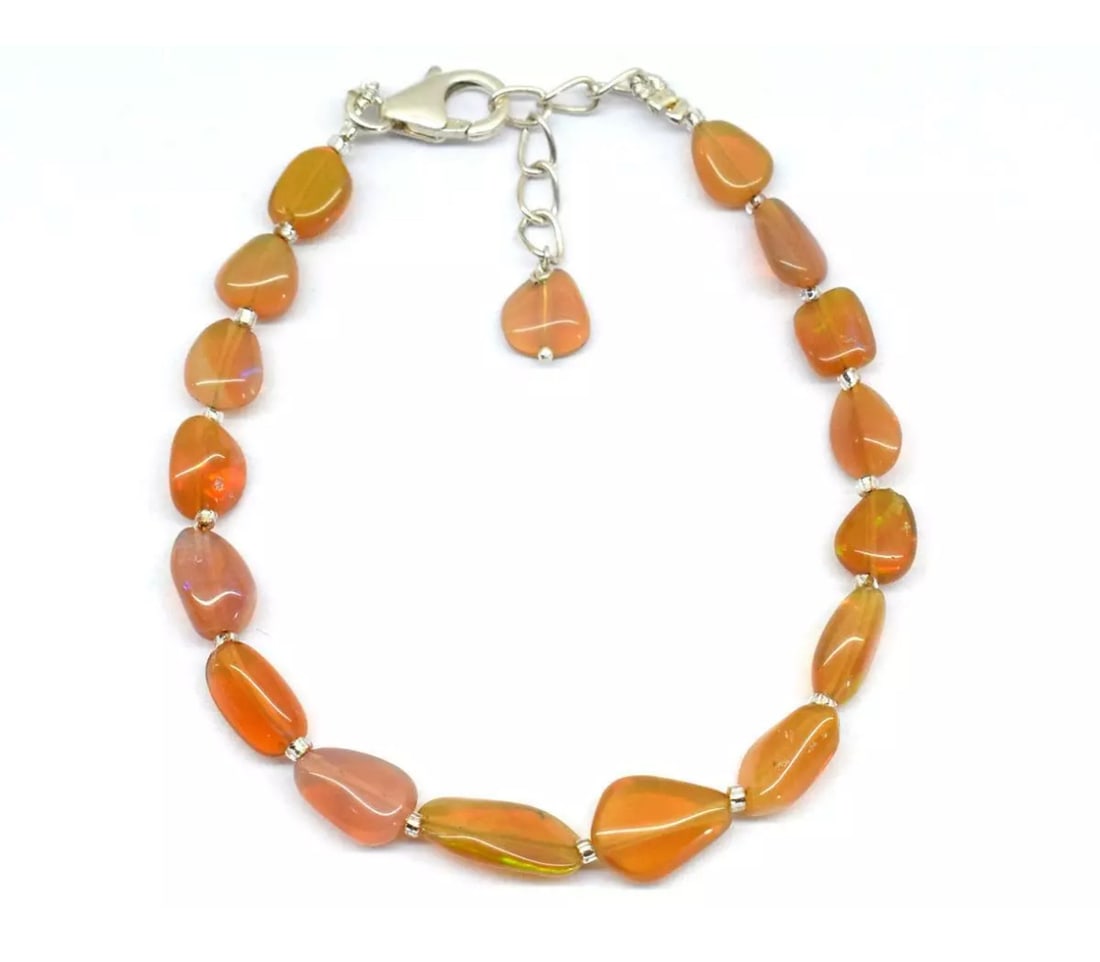 6.5 - 7" SOLID 925 SILVER BRACELET NATURAL ETHIOPIAN OPAL BEADS TUMBLE: These are natural, earth mined and hand crafted with precision. Stone: Ethiopian Opal, Shape: Tumble, Size: 5.5x6.5 - 7.5x10 mm, Width - 3 - 5 mm, Length: 6.5 - 7", Weight: approx. 19 carats. The phot