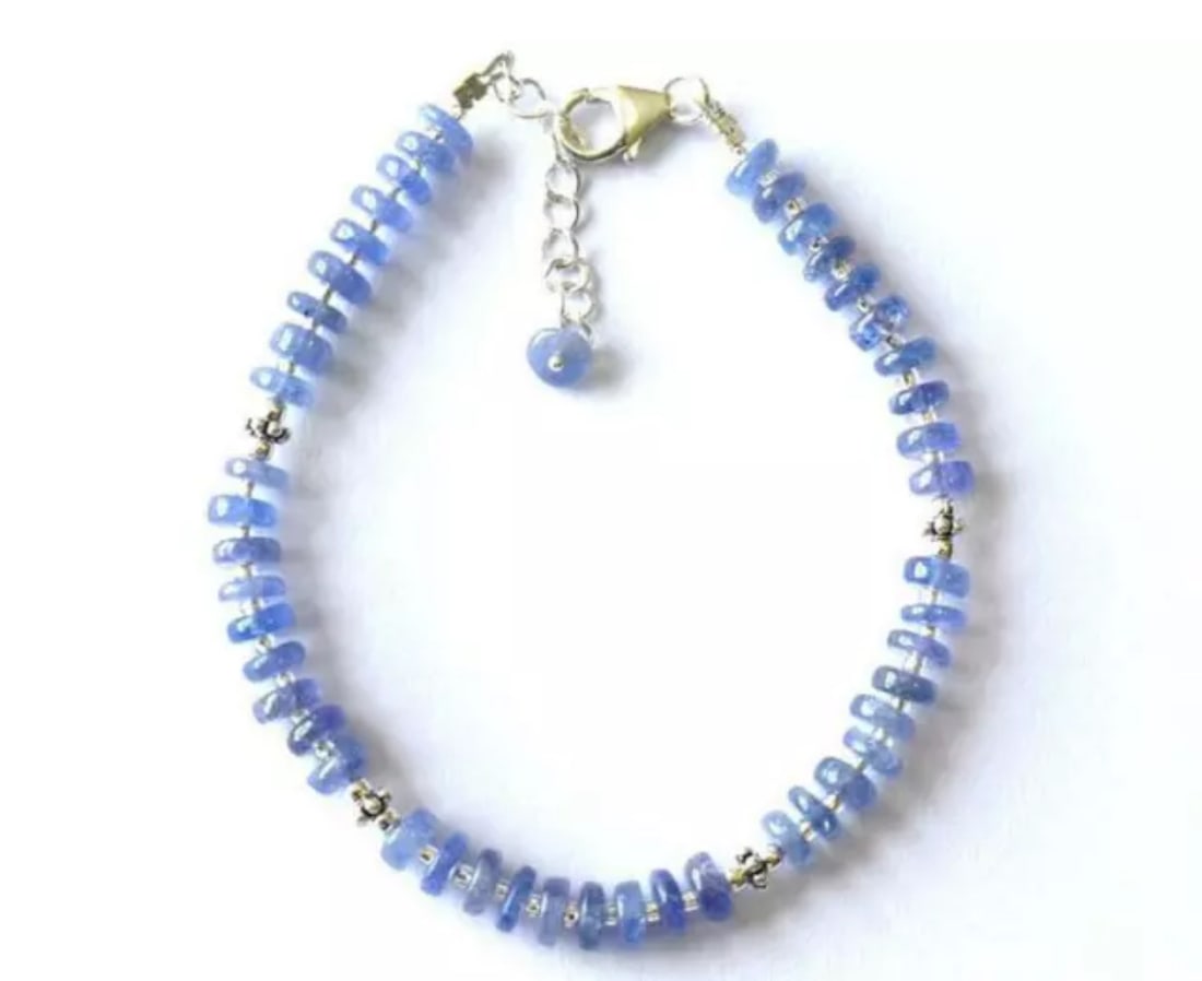 7 - 8" SOLID 925 SILVER BRACELET NATURAL TANZANITE BEADS TYRE: These are natural, earth mined and hand crafted with precision. Stone: Tanzanite, Stone Shape: Tyre, Stone Size: 5 - 5.5 mm, Width: 1.5 - 2.5 mm, Length: 7 - 8", Weight: approx. 39 carats. The photogr