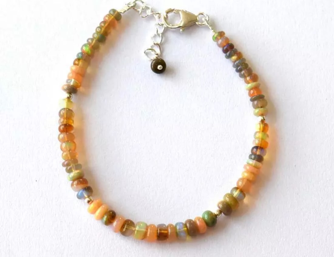 6.5 - 7.5" SOLID 925 SILVER BRACELET NATURAL ETHIOPIAN OPAL BEADS: These are natural, earth mined and hand crafted with precision. Stone: Opal, Stone Shape: Rondelle, Stone Size: 3.5 - 4.5 mm, Width: 1.5 - 2.5 mm, Length: 6.5 - 7.5", Weight: approx. 18 carats. The ph