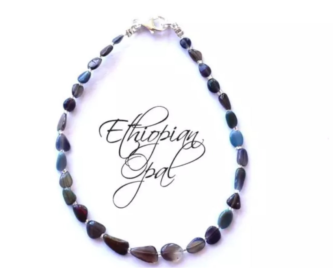 8" SOLID 925 SILVER BRACELET NATURAL ETHIOPIAN OPAL BEADS TUMBLE: These are natural, earth mined and hand crafted with precision. Stone: Opal, Stone Shape: Tumble, Stone Size: 3x4 - 5.5x7.5 mm, Width: 1.5 - 3.5 mm, Length: 8", Weight: approx. 13 carats. The photogra