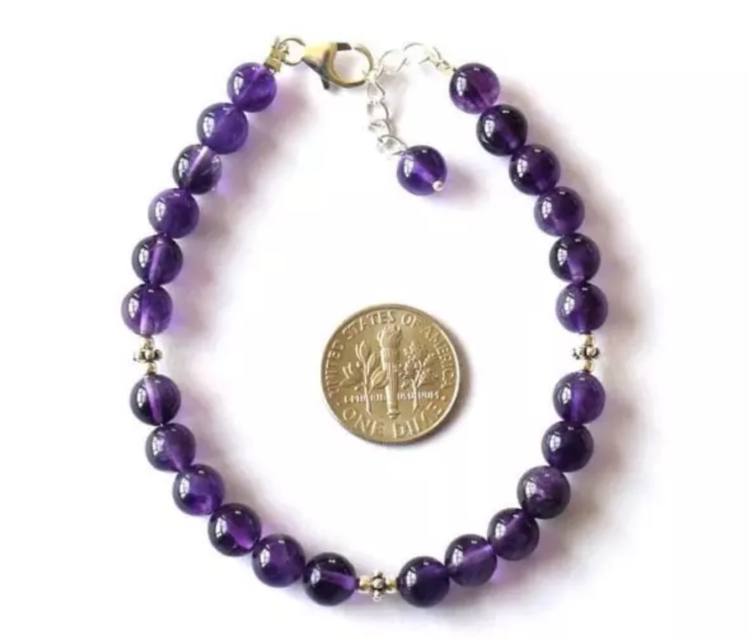7.5 - 8" SOLID 925 SILVER BRACELET NATURAL AMETHYST BEADS ROUND: These are natural, earth mined and hand crafted with precision. Stone: Amethyst, Stone Shape: Round, Stone Size: 6 - 6.5 mm, Length: 7.5 - 8", Weight: approx. 51 carats. The photographs are enlarged t