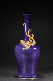 A Daqing Kangxinianzhi Marked Dragon-Painted Gilded Blue Glaze Vase