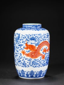 A QING QIANLONGNIANZHI MARKED BLUE AND WHITE FLORAL AND RED DRAGON PATTERN VASE