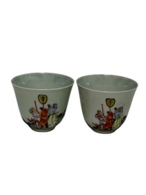 A pair of famille rose figure cups