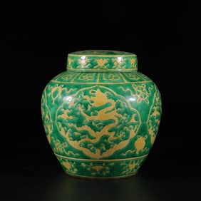 Yellow-green covered jar with dragon pattern