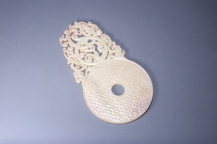 Ancient jade bi with valley and dragon patterns