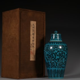 Plum vase with green ground and brown color and twined branch pattern.