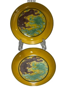 A pair of small butterflies with yellow background and green dragon pattern