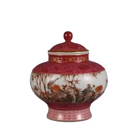 A rouge-red ground, emerald-colored tea caddy with a bamboo and bird pattern.