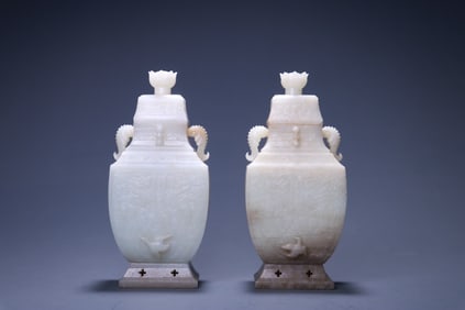 A pair of Hetian jade amphorae with dragon and phoenix patterns
