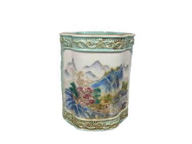 A small brush holder with a carved landscape and figure pattern and a crabapple blossom