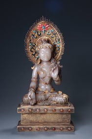 A seated Amitabha Buddha statue inlaid with silver and jade