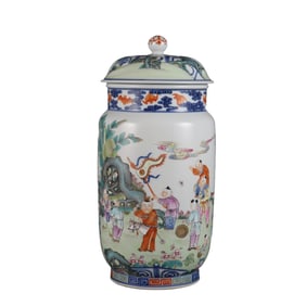 A large jar with a blue and white porcelain and famille rose pattern of children playing