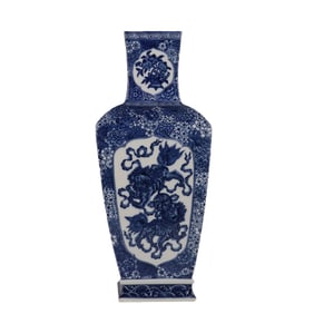 Square vase with blue and white pattern and window-opening lion playing with a ball
