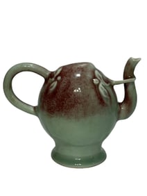 Red-glazed peach-shaped pot