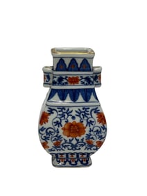 Small flat bottle with blue and white alum red