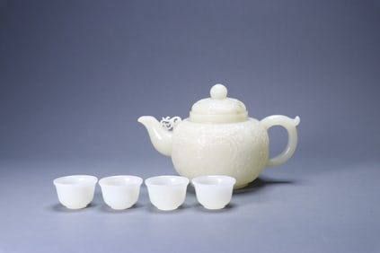 A set of Hetian jade teapots and cups with a longevity pattern