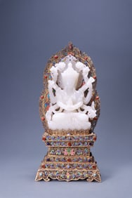 A Hetian jade figure inlaid with silver, gilt, and blue-glazed "Eight-armed Guanyin"