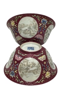 A pair of famille rose red ground climbing flower window landscape bowls