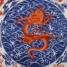 Large plate with blue and white alum red glaze and nine dragon patterns on the sea